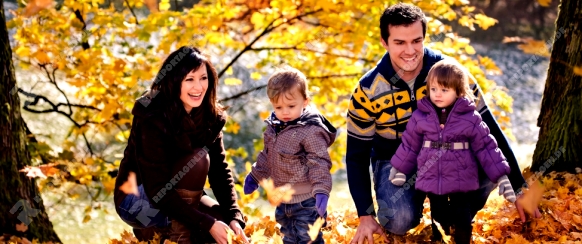 portrait of a young family in the autumn park